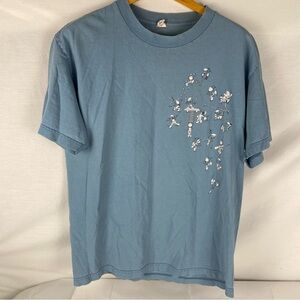 Vintage 90s Smurfs graphic t-shirt in faded blue.